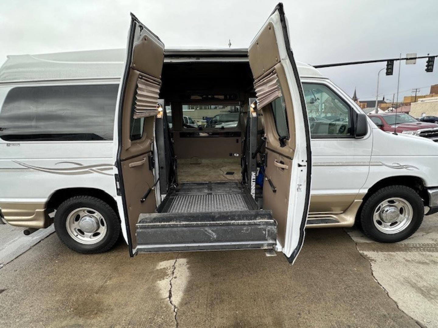 2017 White Ford E Series Van Tuscany Conversion with an 5.4 V8 engine, Automatic transmission, located at 3200 1st Avenue North, Billings, MT, 59101, (406) 245-9055, 45.779270, -108.510742 - Low Mileage, Handicap Accessible Custom Hi-Roof Van. Passenger Side Power Lift with Cargo Doors, 5.4 V8, Running Boards, Designed By Mobility Of Denver and Only 81,000 Miles. CarFax Dealer. Auto Brokers of Montana/AA&A Auto Rental/Fox Car Rental Billings - Photo#2